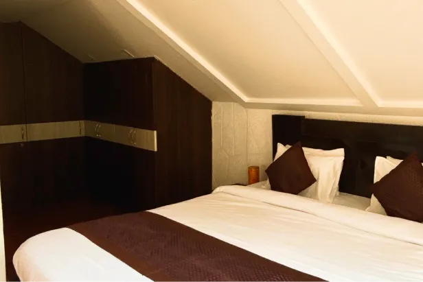 Sweeping valley view from the Madhuram Stays terrace at golden hour