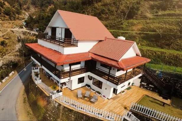 Monal room — air-conditioned bedroom with wooden interiors