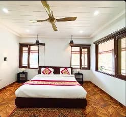 Madhuram Stays property illuminated at night with bonfire